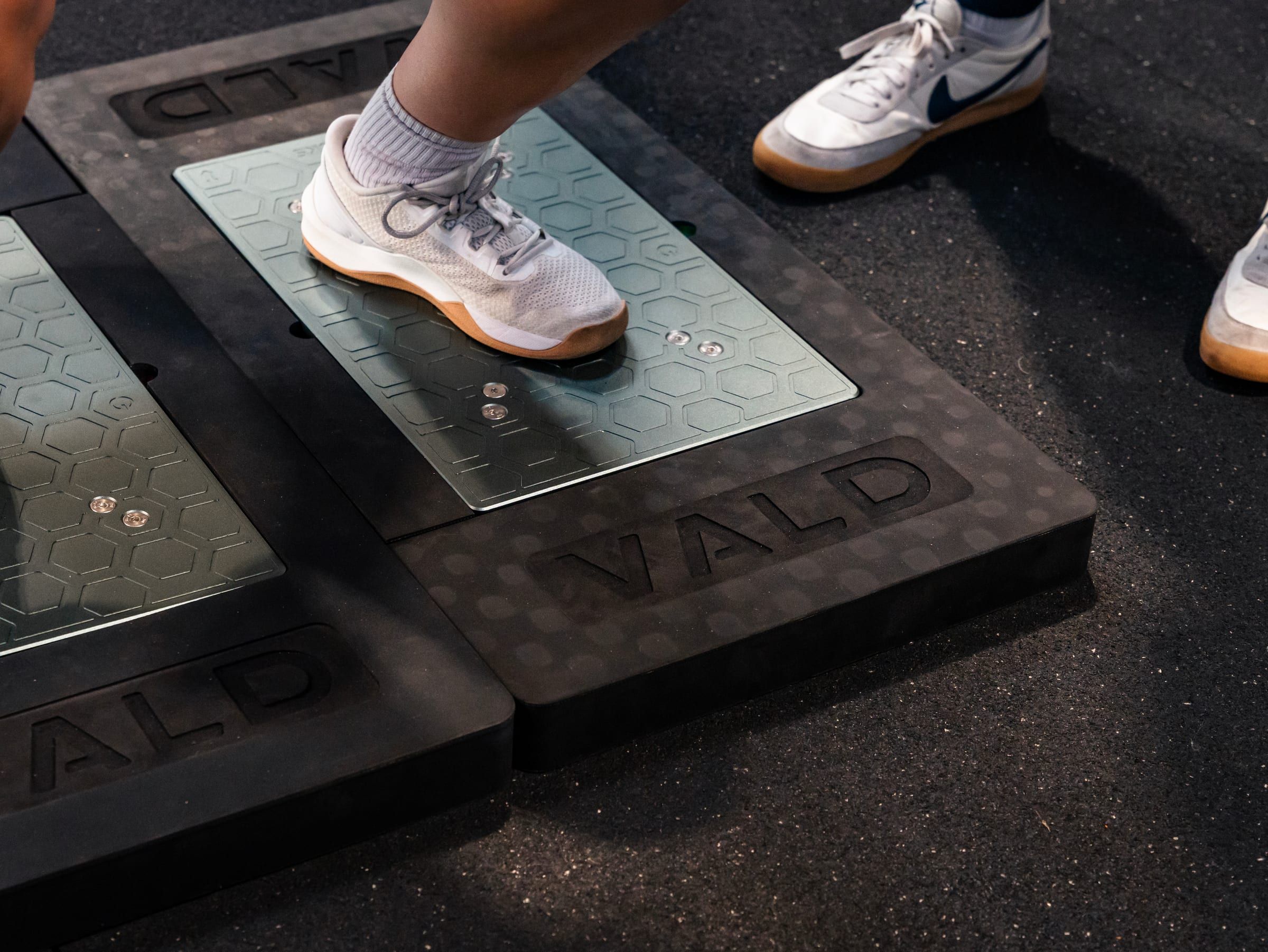 Close-up of a foot landing on a VALD force plate